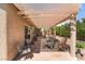 Covered back patio with lounge chairs, potted plants and outdoor furniture at 7559 Chambery Cove Ct, Las Vegas, NV 89123