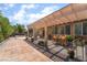 Covered patio features tile flooring, outdoor dining furniture, and views of the landscaped backyard at 7559 Chambery Cove Ct, Las Vegas, NV 89123