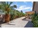 Backyard features desert landscaping, privacy fencing, mature landscaping and covered patio at 7559 Chambery Cove Ct, Las Vegas, NV 89123