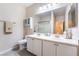 Bathroom with double vanity, enclosed shower and towel rack at 7559 Chambery Cove Ct, Las Vegas, NV 89123