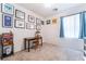 Nicely decorated bedroom with carpeted floors, a desk, and many unique wall decorations at 7559 Chambery Cove Ct, Las Vegas, NV 89123