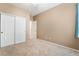 This is a bedroom with carpet floors, closet with sliding doors and neutral colored walls at 7559 Chambery Cove Ct, Las Vegas, NV 89123