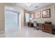 Home office with ceiling fan, artwork, and wood desk setup with printer at 7559 Chambery Cove Ct, Las Vegas, NV 89123