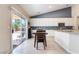 Eat-in kitchen features backyard access through sliding glass door to the outdoor patio area at 7559 Chambery Cove Ct, Las Vegas, NV 89123