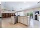Kitchen island with granite countertops, stainless steel appliances, and views of the living area at 7559 Chambery Cove Ct, Las Vegas, NV 89123