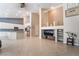 Open concept living area featuring tile floors, recessed lighting and seamless flow to modern kitchen at 7559 Chambery Cove Ct, Las Vegas, NV 89123