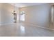 Large living room with tile floors, chandelier, and window with coverings for natural light at 7559 Chambery Cove Ct, Las Vegas, NV 89123