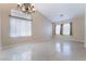 Spacious living room with vaulted ceilings, recessed lighting, and neutral colors throughout at 7559 Chambery Cove Ct, Las Vegas, NV 89123