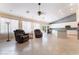 Bright, open-concept living area connects to a well-equipped kitchen with tile flooring and recessed lighting at 7559 Chambery Cove Ct, Las Vegas, NV 89123