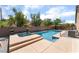 Backyard swimming pool and raised spa with a decorative concrete pool deck at 7559 Chambery Cove Ct, Las Vegas, NV 89123