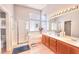 This primary bathroom features double sinks, a shower, and a large soaking tub at 7909 Sierra Rim Dr, Las Vegas, NV 89131