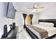 Primary bedroom suite includes a ceiling fan, and a large window that provides ample natural light at 7909 Sierra Rim Dr, Las Vegas, NV 89131