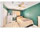 Cozy bedroom features natural light, ceiling fan, neutral wall paint and tiled floors at 7909 Sierra Rim Dr, Las Vegas, NV 89131