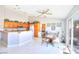 Eat-in dining area with tile flooring, wood cabinets, and a sliding glass door to the backyard at 7909 Sierra Rim Dr, Las Vegas, NV 89131