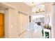 Bright foyer with tile flooring, coat closet, and views into the living and dining areas at 7909 Sierra Rim Dr, Las Vegas, NV 89131