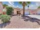 Attractive single-story home featuring desert landscaping, tile roofing, and a two-car garage at 7909 Sierra Rim Dr, Las Vegas, NV 89131