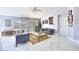 Spacious living room featuring tile floors, contemporary furnishings, and large windows at 7909 Sierra Rim Dr, Las Vegas, NV 89131