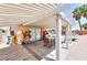 This covered patio has plenty of room for dining with desert landscaping views at 7909 Sierra Rim Dr, Las Vegas, NV 89131