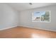 Bright bedroom with wood floors, fresh white walls, and a window offering a pleasant view at 81 Alpine Bay Ave, Las Vegas, NV 89148