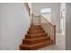 Staircase featuring wood stairs and handrails leading to the upper level at 81 Alpine Bay Ave, Las Vegas, NV 89148