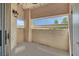 Cozy outdoor balcony space offering a glimpse of the community and covered parking at 8408 White Eagle Ave # 101, Las Vegas, NV 89145