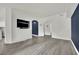 Bright living room with hardwood floors and archways into other rooms at 8408 White Eagle Ave # 101, Las Vegas, NV 89145