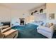 Bright living room boasting a fireplace, comfortable seating, and a vaulted ceiling with decorative greenery at 8450 Alta Dr # 225, Las Vegas, NV 89145