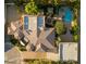 An expansive aerial view reveals the architectural design and manicured grounds of this luxury estate at 8620 W La Madre Way, Las Vegas, NV 89149