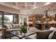 Open floor plan showcasing the living room and kitchen with granite countertops and stainless appliances at 8620 W La Madre Way, Las Vegas, NV 89149