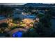Expansive backyard featuring a sparkling pool, lush landscaping, and a charming fountain, perfect for outdoor living and entertaining at 8620 W La Madre Way, Las Vegas, NV 89149