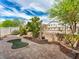 Serene backyard with a brick-paved patio, offering a peaceful outdoor living space at 8728 Tom Noon Ave # 103, Las Vegas, NV 89178