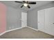 Cozy bedroom features a ceiling fan, closet, and plush carpeting at 8728 Tom Noon Ave # 103, Las Vegas, NV 89178