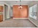 Dining room with a chandelier and tile flooring, bathed in natural light from a window at 8728 Tom Noon Ave # 103, Las Vegas, NV 89178