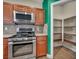 Well-equipped kitchen features stainless steel appliances and a convenient walk-in pantry at 8728 Tom Noon Ave # 103, Las Vegas, NV 89178