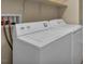 Bright laundry room showcasing a modern, white washer and dryer set at 8728 Tom Noon Ave # 103, Las Vegas, NV 89178