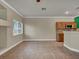 Bright living room, connected to the kitchen, featuring tile floors and an open layout at 8728 Tom Noon Ave # 103, Las Vegas, NV 89178