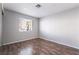 Cozy bedroom with wood floors and a window to let in plenty of light at 912 Falconhead Ln # 101, Las Vegas, NV 89128