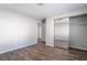 Spacious bedroom features wood-look floors and a mirrored closet at 912 Falconhead Ln # 101, Las Vegas, NV 89128