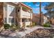 Well-maintained condo with private balcony, secure gated entry, and beautifully landscaped common areas at 912 Falconhead Ln # 101, Las Vegas, NV 89128