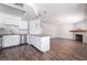 Bright kitchen featuring white cabinets, stainless steel appliances, and hardwood floors at 912 Falconhead Ln # 101, Las Vegas, NV 89128