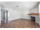 Spacious living room featuring wood floors and a stylish fireplace that adds a touch of elegance at 912 Falconhead Ln # 101, Las Vegas, NV 89128