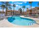 Community pool and spa offers a refreshing escape with ample lounge seating under the sunny sky at 912 Falconhead Ln # 101, Las Vegas, NV 89128