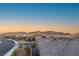 Gorgeous aerial view of neighborhood with beautiful views of mountains in the background at 964 Edinburgh Fields Ct, Las Vegas, NV 89138