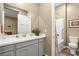 Serene bathroom with a double vanity, modern fixtures, and separate shower area at 964 Edinburgh Fields Ct, Las Vegas, NV 89138