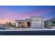 Inviting single-story home featuring a stone facade and a well-manicured front yard at 964 Edinburgh Fields Ct, Las Vegas, NV 89138