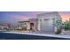Beautiful single-story home featuring a stone facade and a well-manicured front yard at 964 Edinburgh Fields Ct, Las Vegas, NV 89138