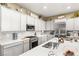 Well-equipped kitchen featuring stainless steel appliances, white cabinetry, and elegant countertops at 964 Edinburgh Fields Ct, Las Vegas, NV 89138