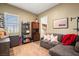 Inviting living room with a comfortable couch, ample storage, and cozy decor at 964 Edinburgh Fields Ct, Las Vegas, NV 89138