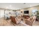 Inviting living area featuring modern kitchen views, comfortable seating, and stylish decor at 964 Edinburgh Fields Ct, Las Vegas, NV 89138