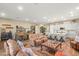 Spacious living room featuring a large island with stools, comfortable seating, and ample space for entertaining at 964 Edinburgh Fields Ct, Las Vegas, NV 89138